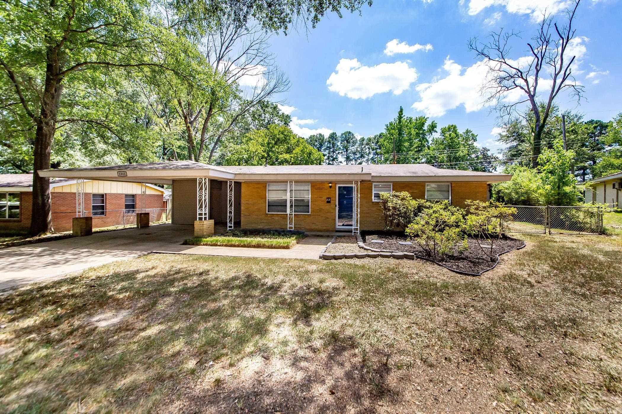 Welcome to this charming 3 bedroom, 1.5 bath home offering fresh updates and plenty of space! Inside youāll find newly painted interiors that create a light and inviting atmosphere, complemented by durable flooring throughout. The kitchen features a natural gas stove, stainless steel appliances, white cabinetry, and a stylish subway tile backsplash, opening to a dining area perfect for family meals. The living spaces are generous, including a bright sunroom that adds extra flexibility for a home office, playroom, or cozy retreat. The oversized primary bedroom offers its own half bath for convenience, while the additional bedrooms share a refreshed full bath with modern finishes. Step outside to a large backyard featuring mature trees, a fenced-in area, and an impressive workshopāideal for hobbies, storage, or a home business. With a covered carport, new HVAC installed in 2024, and thoughtful updates throughout, this home combines comfort, functionality, and value. Move-in ready and waiting for its next owner!