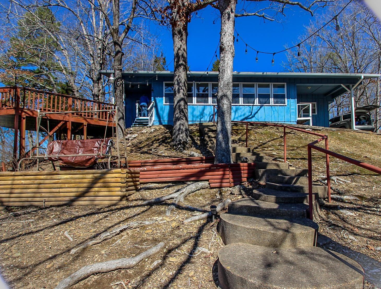 Lake Norrell property waiting for You! This mobil home is a cute cottage style with insulated windows and doors. A sunroom has been added on overlooking the lake perfect for entertaining. It features a large deck and a boat dock with 2 boat slips. come see it today wouldn't you love to start enjoying the oh so perfect lake life.