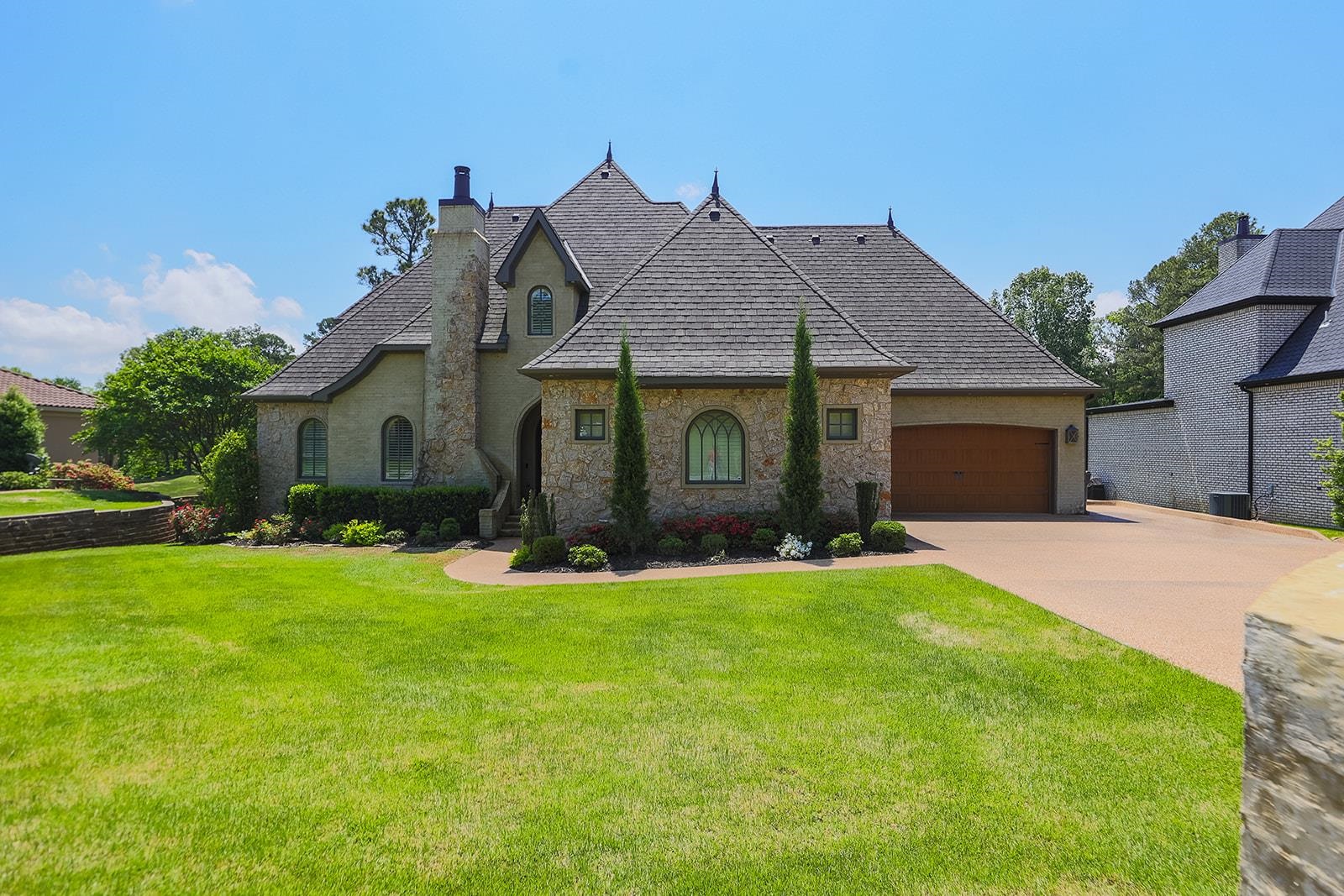 If you're looking for luxury, 3821 Riviera Dr. is the home for you! The exterior has ultimate curb appeal with a beautiful blend of slurry brick and stone. There are 3 bedrooms and 2.5 bathrooms on the main level, with 2 bedrooms, full bath, loft area, and a bonus room located upstairs. The kitchen is what dreams are made of with professional grade appliances, including a 48 dual fuel range and ice maker, apron sink, zinc mantle style range hood, and huge island with a custom reclaimed white oak countertop. This home is full of custom details like the vaulted wood ceiling, 7 ft wainscot paneling, and 17ft brick fireplace in the living area. There is a study just off the front entry and features shiplap walls, diamond grid ceiling work, and a fireplace. The large primary suite offers custom beams, 3 transom style windows, sliding patio door, a spacious bathroom with large dual head tile shower, his and her vanities, and a custom closet with access to the laundry room. Be ready to entertain outside with a screened porch, outdoor kitchen, custom ipe deck, and beautiful views of the golf course. This house is immaculate and ready to be home for its new owner.