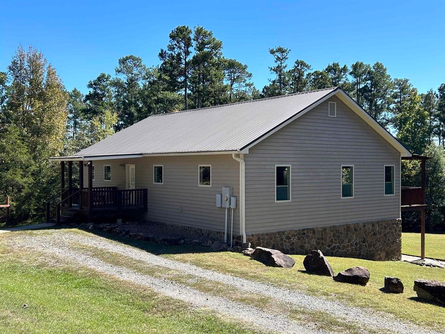 Heber Springs area, home with view of sugarloaf mountain. Well maintained property with ample storage and well thought out floor plan. All windows are extra large picture windows, metal roof, and completely surrounded by large mature trees. Call soon because this one wont last long.