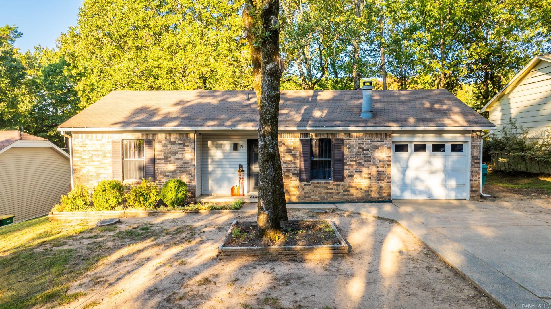 19 Point West Circle in West Little Rock.  My favorite thing about this part of town is how close we are to literally everything.  Less than 5 minutes from interstate access and incredible shopping like Lowe's, Target, and Whole Foods, this location is the definition of convenience!  Inside you're greeted immediately with with updates that span the entire home.  The living room boasts a wood-burning fireplace for cozy evenings.  The kitchen was recently updated with new appliances, granite countertops, and bar height seating area.  This home has two wonderfully spacious bedrooms and a fully updated bathroom.  Don't miss the large fully fenced back yard, storage shed, and spacious garage.  We're excited for you to come and see if it's yours.  19 Point West Circle - Welcome Home