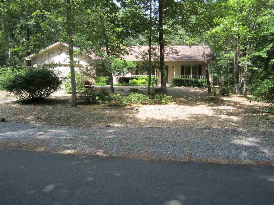 Tumbled marble backsplash in kitchen, granite counters, wood laminate flooring bedrooms, ceramic tile in kitchen, laundry, baths and entry. Covered front and back porch, 12' x 16'. Located in the heart of the Village near the fitness center.  Recent home appraisal was $159,000--Priced to sell and is not negotiable...