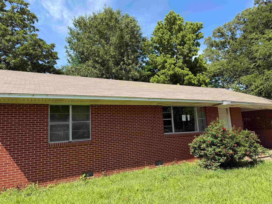 3BR/1.5BA brick home with 1,318 sq ft featuring spacious front and back yards, mature trees, and solid construction. Home needs TLC and updating but offers great potential for investors or buyers wanting to add value. Functional layout with opportunity to customize and make it your own. Sold as-is.