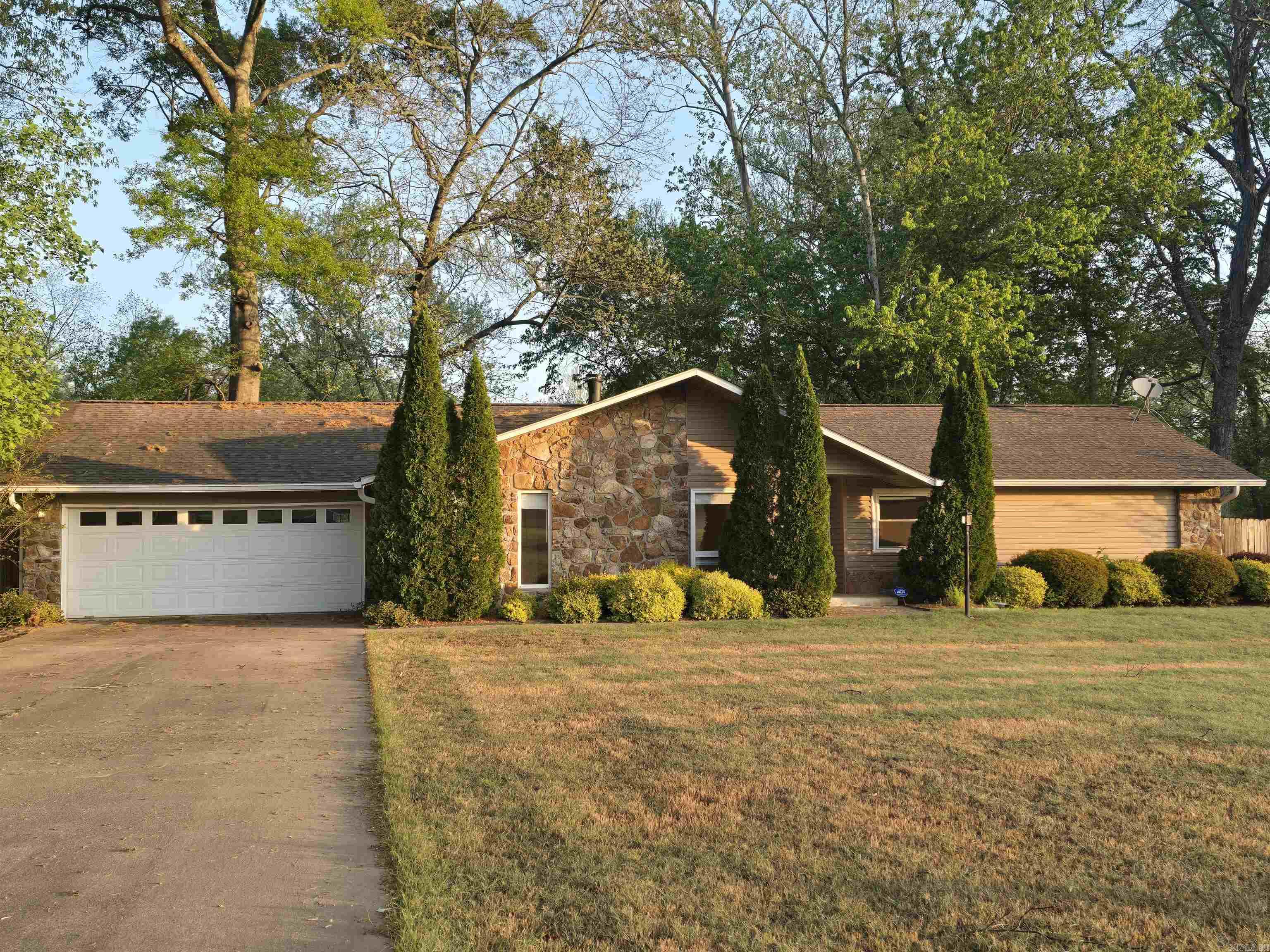 Imagine the morning fog just lifting off of the water to reveal the gorgeous Little Red River that's right in your back yard! Welcome to the market 9 River Drive Estates in Pangburn, Arkansas! This 1996 built home features 3 bedrooms, 2 bathrooms, 2 living areas, laundry and pantry area and a spacious 2 car garage with an office space. This gorgeous home was updated in 2023 with interior paint, a new roof and gutters, further ensuring that it remains beautifully maintained! Also featuring a security system, Pella energy saving windows and glass doors and siding with a lifetime warranty. Large custom closets offer tons of storage space as well. In the kitchen you will find granite countertops and a stone backsplash. Just off of the kitchen are big beautiful bay windows that overlook the river. From the den that offers a wood burning fireplace, step out the sliding glass door onto the patio overlooking the river as well. Walk down the steps to the landing area then further down to the Little Red River from your own backyard! Stunning landscaping offers additional beauty in your back yard. This home has SO much to offer and will NOT last long! Call today before it's gone!
