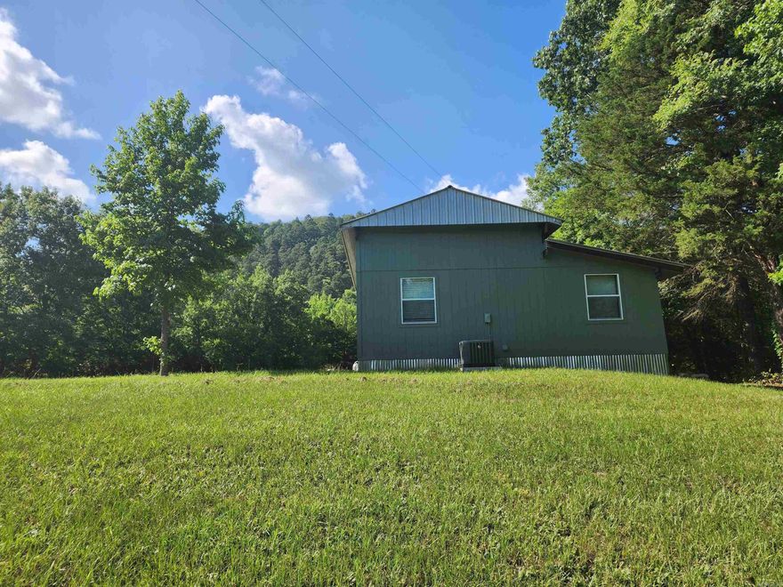 38 acres of truly beautiful wildlife, awesome views, creeks and rolling hay meadows that border the National Forest. If that's not enough it features an adorable 480 sqft 2 bed room, 1 bath, fully furnished cozy cabin with open kitchen/dinning and combo sitting area. It features beautiful tall wood beaded ceilings through out the kitchen, living rm, hall and bathroom area.  It's ready to move in and is equipped with a refrigerator, electric stove, washer, dryer, tank less hot water heater, wood burning stove and central heat and air. Enjoy the breath taking view of the mountain side from your living rm window or step outside onto the back deck and listen to the year around creek as it moves with the seasons. Enjoy all the area has to offer with its hunting, local creeks, rivers, swimming holes, ATV trails, hiking, fishing, biking trails, canoeing, scenic routes, star gazing, digging for your own crystals and access to thousands of acres of the Ouachita National Forest.  Hop on your ATV and enjoy the beautiful drive as you work your way to the trails on the back roads. No restrictions.  Proof of funds or pre-approval letter needed.