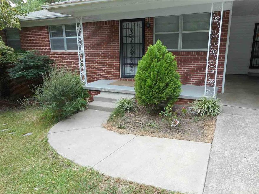 Great location-walk to Baptist Hospital!! Brick traditional with new paint, original wood floors in living rooms, bedrooms, tile in kitchen/dining, and baths. Extra sunroom off sliding doors. Large laundry/pantry/storage area. Nice sized fenced yard and carport.