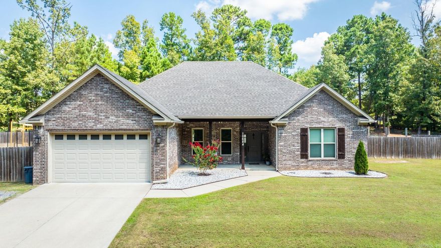 Absolutely Stunning “Like New” Home on 1.49 Secluded Acres.Nestled on a private road,this immaculate open floorplan home sits on 1.49 acres of fully fenced grounds, featuring a custom wood playset,a charming chicken coop w/run,extra parking carport,an 8’ x 10’ storage shed on concrete slab & a 6’ x 3’ concrete pad for a propane tank or generator. The expansive 58’ x 13’ patio offers both covered & uncovered areas, French drains in backyard & maintenance-free landscaping. Inside, the home boasts hand-scraped wood floors, trey ceilings,beautiful fireplace, custom antiqued kitchen cabinetry,breakfast bar w/seating & a sink w/newly installed "glass rinser", a newly tiled master bath with a modern shower & floor & a spacious 8’3” x 6’8” walk-in closet. Additional features include a dining area w/built-in bay seating, a laundry room w/cabinetry & a sink, and a garage w/ample storage, insulated doors, & a “slip-grip” floor coating. Enjoy the 19’10” x 8’7” front porch with a swing and a detached 7’3” x 9’4” finished office/mancave/she-shed w/AC & electrical.Everything you could want in one perfect spot.