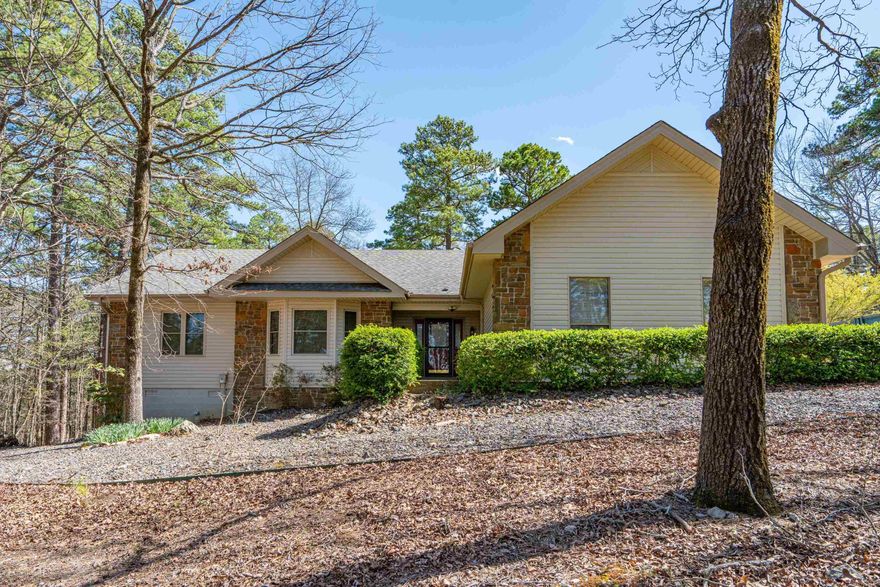 Welcome to 2 Dias Ln., a beautifully maintained 3bd, 2bth, home offering 1,896 sq.ft of comfortable living space. Nestled in the serene and sought-after Hot Springs Village community, this home features numerous updates, making it move-in ready!  Step inside to find gorgeous wood flooring throughout the main living areas, while the bedrooms are comfortably carpeted. The kitchen has been upgraded with sleek quartz countertops, while the bathrooms features granite countertops for a polished look. This home also offers a dedicated office space, perfect for remote work or a quiet retreat. Recent updates include new windows (2022) and new vinyl siding (2024), enhancing both energy efficiency and curb appeal. The roof (2018) provides lasting durability and peace of mind. For those who love to tinker or need extra storage, the HUGE enclosed workshop is a fantastic addition. The 2-car garage offers plenty of space for parking and storage. Outside, enjoy the natural beauty of Hot Springs Village from your private deck or take advantage of the community’s world-class golf courses, scenic trails, lakes, and abundant amenities. MOTIVATED SELLER!!
