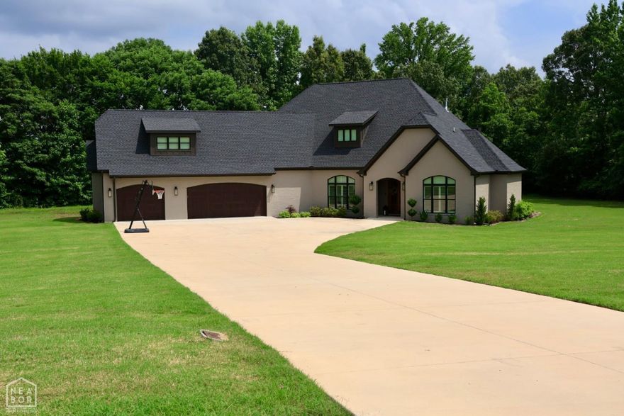 This home is truly one of a kind with so many upgrades and extras, sitting on just over 3 acres.  This home was custom built for the builder himself, with no details spared. There are 3 large bedrooms on the main level each having their own private bathroom.  The main level has high end hardwood flooring throughout, with porcelain tile in the bathrooms.  The main floor has many built-ins and extra tall doors and ceilings throughout.  The living room has a gas fireplace, and is also where you will go out to the extra large patio.  The patio also has a fireplace, is heated and cooled (included in county record sqft), and has retractable screens.  The kitchen is open to the living room, eat-in breakfast area, and adjacent to the formal dining room. The wet bar will lead you into the extra large pantry. The master suite features dual vanities, free-standing soaker tub, custom granite walk-in shower with dual shower heads, and a large walk-through closet that leads to the laundry room.  The upstairs could be a 4th bedroom or huge bonus/media room.  There is a closet leading into it, and a full bathroom upstairs. This home has the perfect country feel, but also just minutes from town.