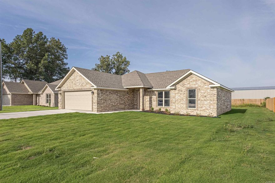 BRAND NEW and LOWEST PRICED new construction in the city limits of Trumann! This home has an open floor plan with the finest touches. Granite countertops, recessed lighting throughout and beautiful acid stained floors. The home has neutral colored walls and large windows for natural lighting. The living room and master have towering tray ceilings. You'll love the master bath and the custom built master closet! This home sits at the end of the street with minimal traffic. The exterior is all brick, has soffit lighting, and a large covered back porch for entertaining. Call TODAY to schedule your showing!