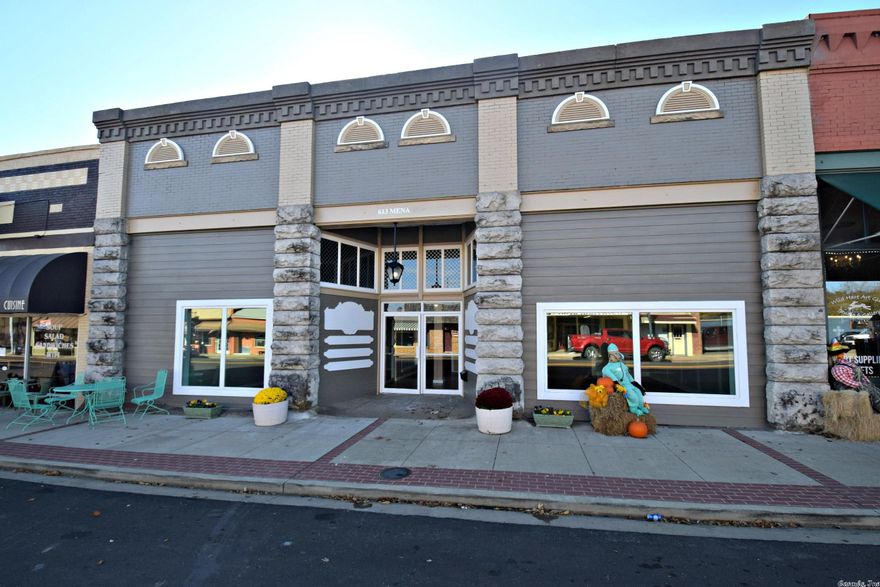 Recently remodeled, fresh storefront on Mena St., awesome location, visibility and high traffic and tourist presence. Roof was replaced in 2009 with recent updates to subflooring and joists, fresh paint throughout, water heater replaced and bathrooms have new fixtures and plumbing updated. There are a total of 12 offices/rooms. A total of 4, 1/2 baths and 1, 1/4 bath. There is one suite with private bath, 1 set of public 1/2 baths and the other offices share the remaining. Receptionist/business center area.  This would make a great retail shop, boutique shop, etc, Possibilities are endless with this building and location. Some owner financing possible.