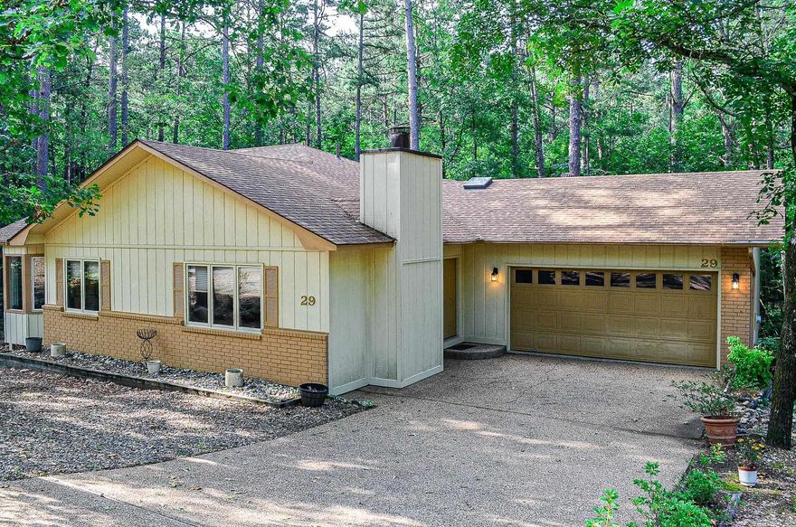 This 2 bedroom 2 bath home offers spacious rooms. Enjoy the expansive Arkansas room plus screened deck. Roomy double garage. Appreciate all the wood flooring, brick fireplace, vaulted living area ceiling and abundant cabinetry. Private backyard.  The adjacent lot is included. Oodles of storage areas. Hot Springs Village Property Owners Association has a new member buy-in fee of $2000.00 due and collected at closing.