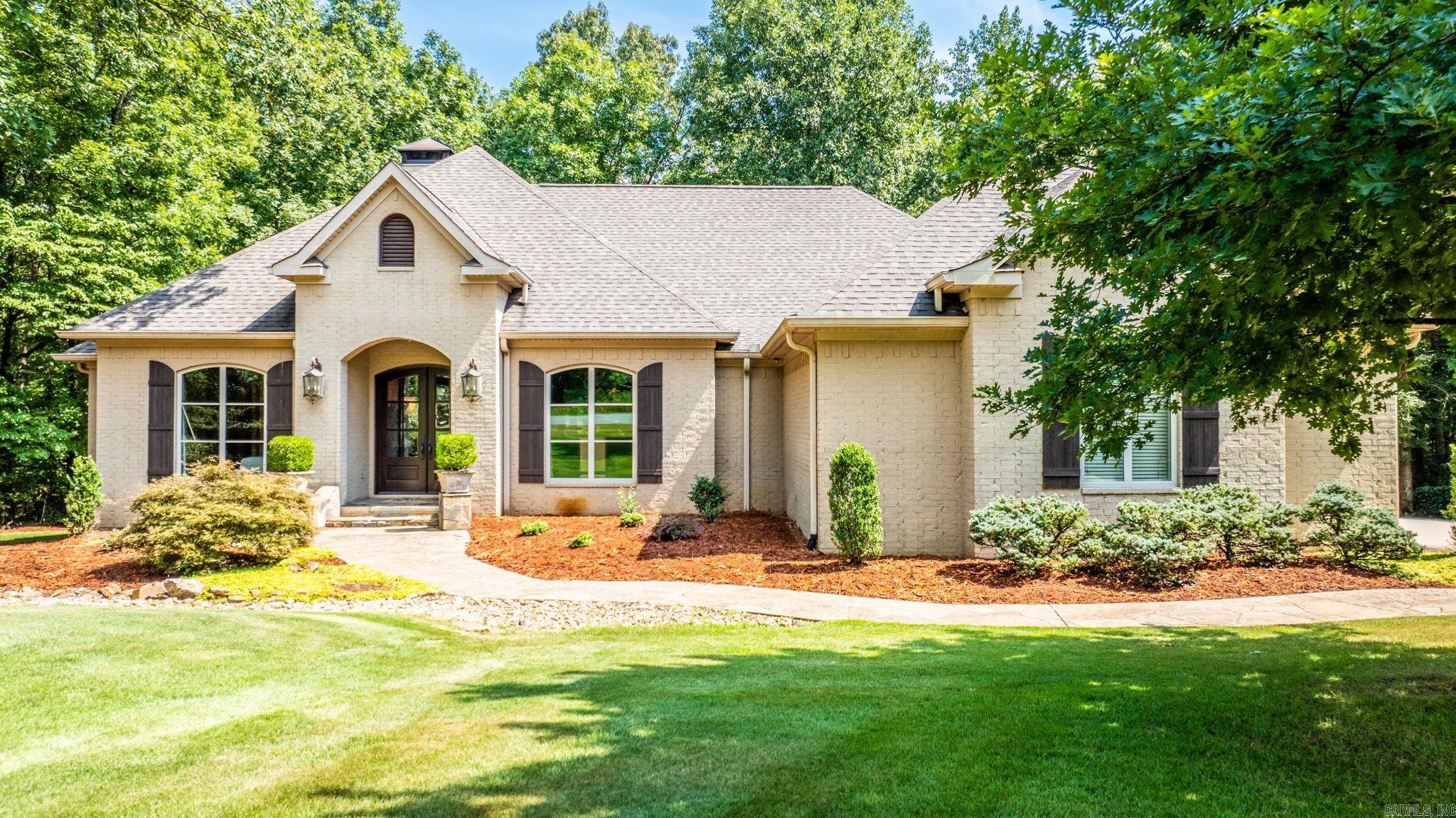 Meticulously maintained one owner custom built home on 3.15 acres. If you have pictured yourself sitting on your back porch looking out over private woods watching wildlife and enjoying nature, this is your chance! Quality finishes and attention to detail await you in this serene setting and home. Gourmet kitchen with soft close painted wood cabinets by Duke cabinets and gorgeous slab granite countertops, stainless appliances. Kitchen opens to great room with fireplace and wall of windows overlooking covered back porch and back yard. Sitting room off Kitchen could also be breakfast room. Formal dining room off foyer. Primary bedroom with wall of windows that brings the outside in. Spa like bath with separate vanities, soaking tub, shower, spacious closet, powder room. Two additional bedrooms apart share beautiful full bath with tub/shower and custom vanity. Attached 27.2 x 17.9 heated and cooled shop could be gameroom or media room. Shop is included in square footage. Finished out with unstained concrete floor. Generator. This is truly a special home with designer touches.