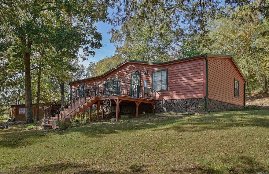 Sitting proudly upon the hill, this well-maintained double wide offers beautiful sunrise views and a peaceful country feel. Inside, you’ll find a spacious split floor plan perfect for entertaining, featuring a kitchen with abundant counter space and ample storage. Each bedroom includes a large walk-in closet for added convenience. Step out onto the front deck to enjoy the views, or relax in the backyard where raised garden beds are ready for your green thumb. A brand-new storage building with electric provides plenty of space for your hobbies. Additional shed with two rooms & a lean-to are great for storing your mower & gardening equipment.  Agents see remarks.