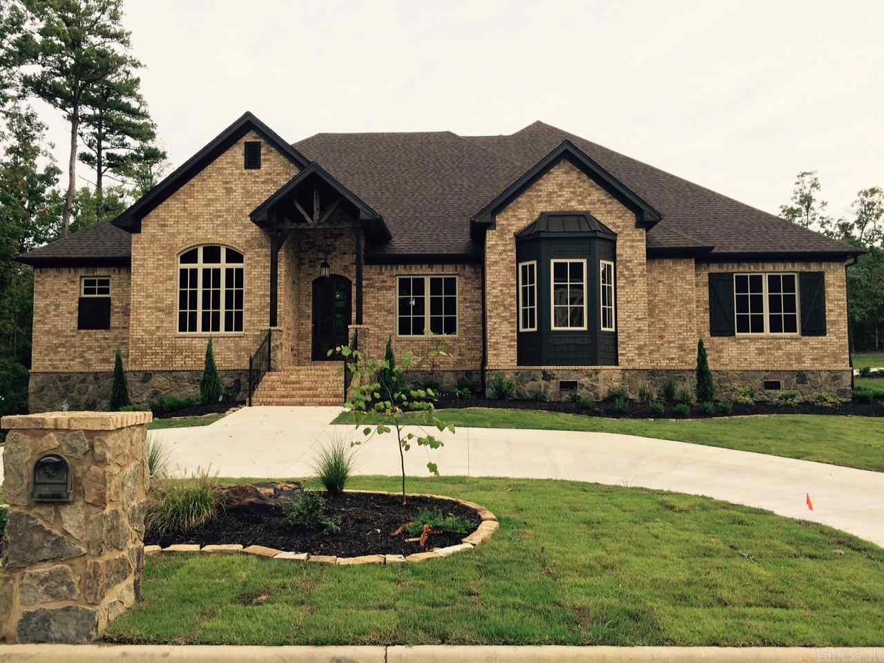 Custom home on a beautiful wooded lot with many upgrades.