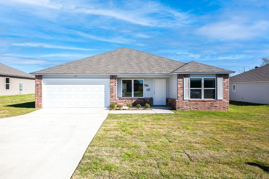 $5,000 towards a fence or closing with a full price offer!! Welcome to your dream home in the highly sought-after Cabot School District! This stunning 4-bedroom residence boasts a modern open concept design with a split floorplan, perfect for privacy and functionality. The interior features a contemporary color palette of white and grey, accentuated by a striking navy accent wall in the luxurious master bedroom. Indulge in the spa-like soaker tub/shower combo in the master bathroom, and enjoy the convenience of an 8-inch deep kitchen sink and a stylish 16-inch laminate bar top in the kitchen, ideal for entertaining guests. The home is adorned with high-quality luxury vinyl plank flooring in wet areas and living rooms, combining elegance with easy maintenance. Don't miss the opportunity to make this exquisite home yours - schedule a viewing today as this gem won't stay on the market for long!