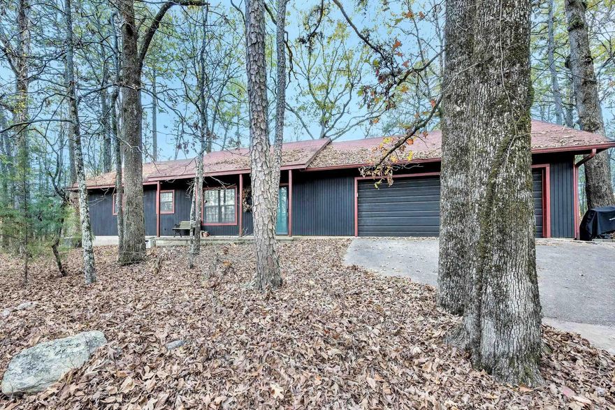 Discover the perfect blend of country tranquility and city convenience! Nestled on 5.83 acres of private, serene land, this charming home offers the peace of rural living just minutes from all the amenities you need—only five minutes from Costco and the Promenade.  With three spacious bedrooms and two and a half baths, this home features an inviting wood-burning fireplace and ample storage throughout, including built-in shelving. A two-car garage and a separate, large, insulated utility building, with high ceilings to provide extra space for your projects and storage needs.  Surrounded by nature, the property backs up to the peaceful Chenal Downs, offering abundant wildlife and a truly private setting. With multiple outbuildings, well water, and a solid structure, this home presents a unique opportunity for the new owner to personalize and create their dream country retreat. Whether you’re looking for a quiet escape or a space to expand, this home is full of potential and waiting for you to make it your own!