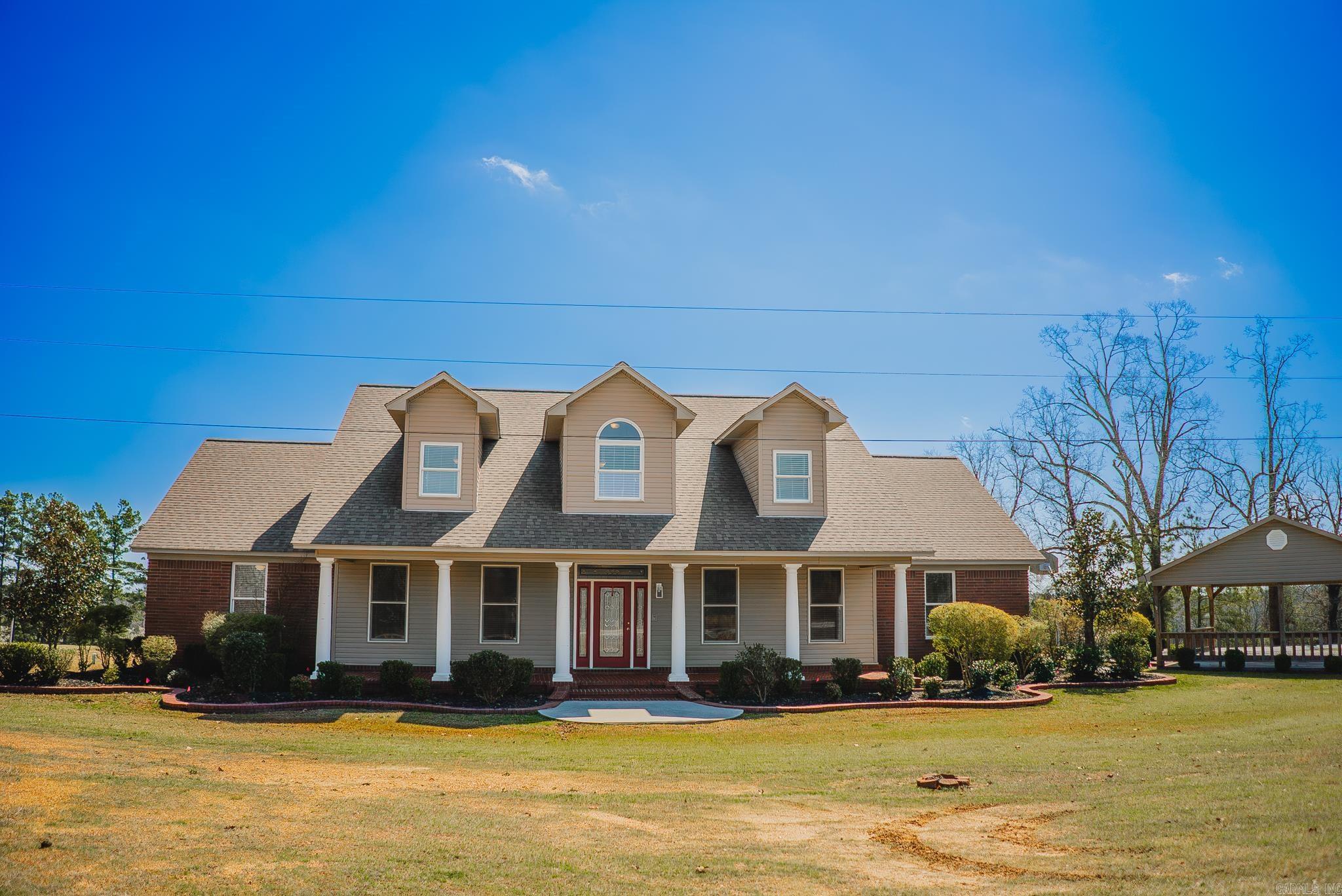 Welcome to 588 Old Hwy 13, a spacious 4600 sq. ft. home offering a perfect blend of country living and town convenience. Set on 5 acres, it provides a serene, rural atmosphere while being just minutes from local amenities. The property features a two-car garage, a detached carport, and a 1,500 sq. ft. shop with 12 ft. ceilings, two 12x10 ft. doors, two 12x42 ft. awnings, plus gas, water, and a half bathāideal for projects, storage, or a workshop. Inside, the first floor includes a primary suite with backyard access and a private bath, three additional bedrooms, two with a shared hall bath and one with a private bath. A convenient powder room is perfect for guests. The main living area offers a great room, kitchen, laundry room, and a heated/cooled enclosed back porch. Upstairs, youāll find a versatile and generously sized bonus room, a dedicated office, an additional room, and a full bath for added convenience. Out back, relax on the detached deck overlooking the gently sloping pasture, offering peaceful views and a true country feel. With a spacious layout, impressive shop, and an ideal location near town, this property offers the best of both worlds. Schedule your showing today.