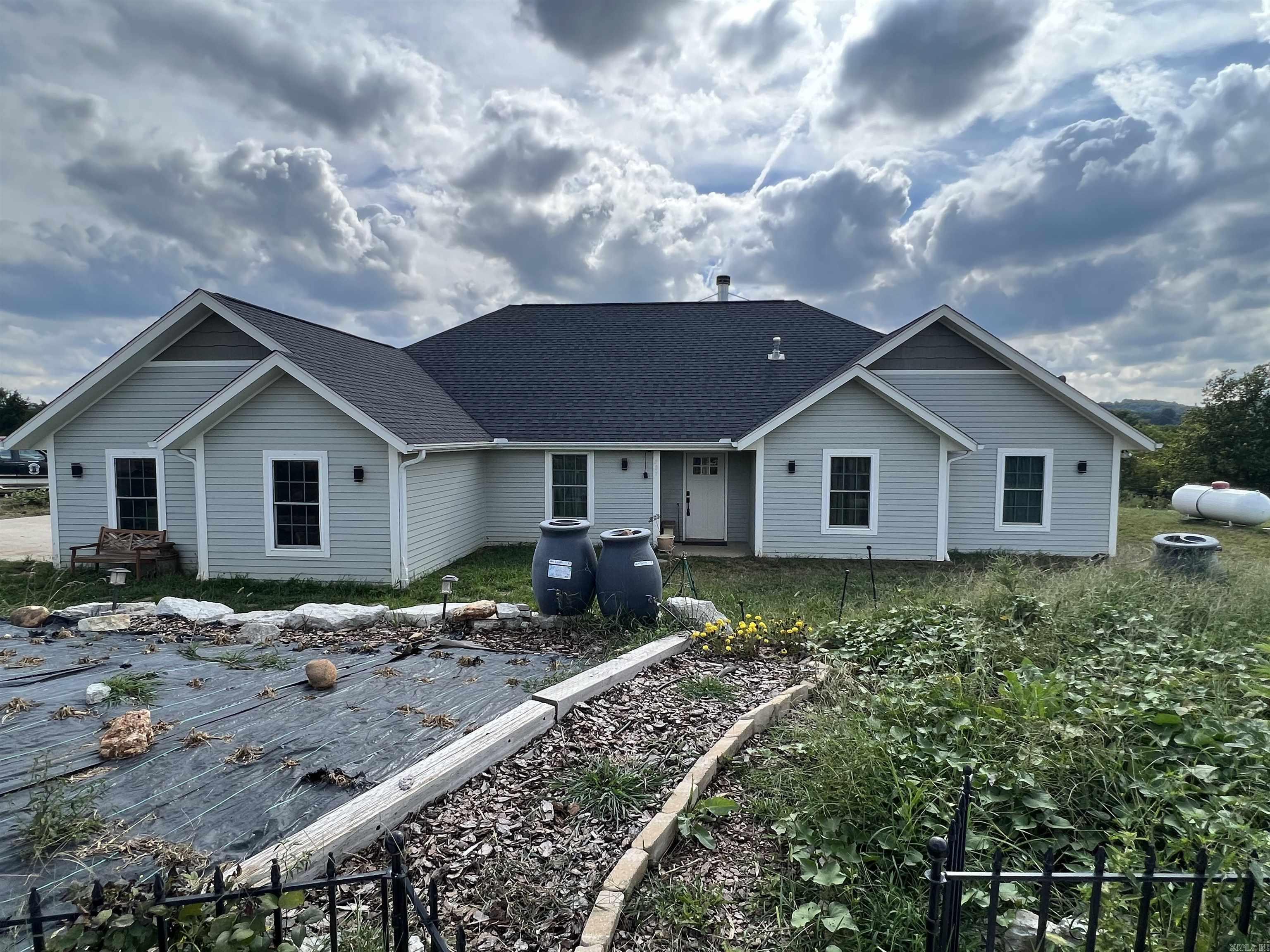 Great Ozark Mountain homesteaders mini farm. Come check out this 5 BR, 3.5 BA, 2,141 SQFT, 2 car garage, and 6.71 acres m/l. The home features granite countertops, wood fireplace, wood stove location, walk-in closet, pantry, and much more. The land is all in fenced pasture for livestock and has a 30’ x 40’ metal shop with concrete floor and electric. Call today to schedule a showing.