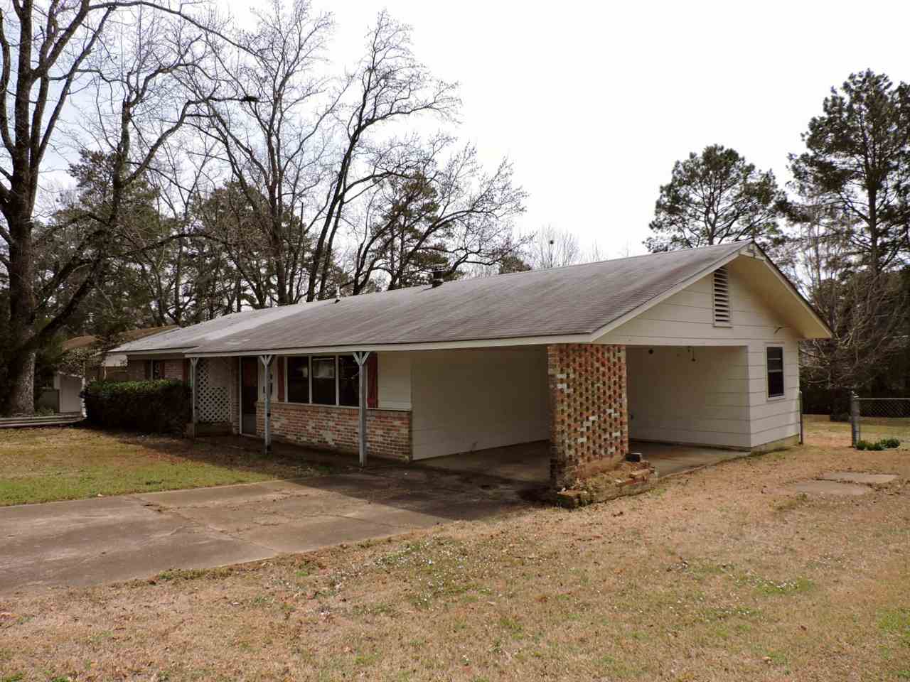 One level brick & siding ranch style home situated on a level lot and conveniently located within 3 miles of Henderson State and Ouachita Baptist Universities. Home features 3 bedrooms, 2 bathrooms, central heat, central cool, wood burning stove, attached 1 car carport, open porch, covered patio, two out buildings and fenced backyard. (SEE AGENT REMARKS)
