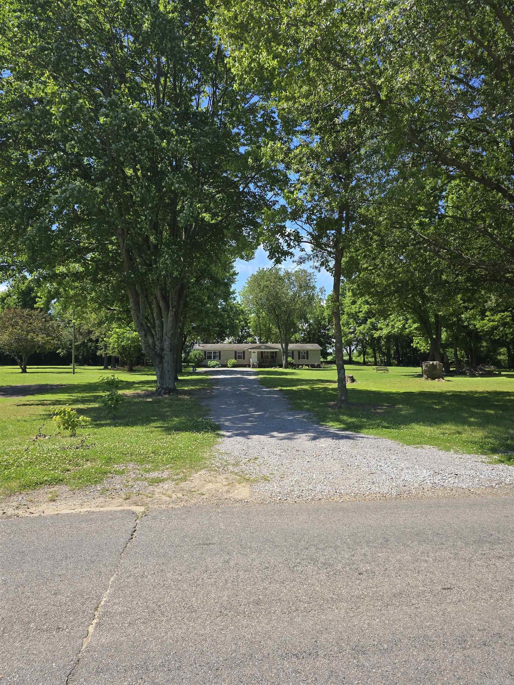 Rare opportunity to own approx. 2 acres within the city limits! 3 Bedroom, 2 Bath Manufactured home sitting on approx 2 acres! Open floor plan with separate dining and eat-in kitchen with breakfast bar. Formal living room separate from great room. Cozy up by the wood burning fireplace for those chilly winter nights or enjoy sitting on the front or back decks to enjoy those warm summer nights. Plenty of room to roam on the 2 acres that possibly could be subdivided. Schedule your personal tour today!
