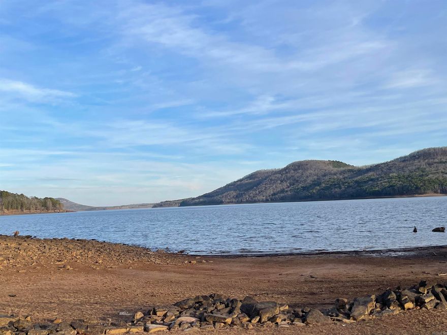 Welcome to your dream waterfront escape on Greers Ferry Lake! This spectacular 1.62-acre lot, nestled in the prestigious Burnt Ridge Estates Subdivision, offers the perfect canvas for creating your own lakeside haven. Situated in the highly sought-after Burnt Ridge Estates Subdivision. This lakefront lot provides an idyllic setting for your new home. Experience the tranquility of lakefront living with a small walk to the water's edge. Dive into a world of endless water activities – from swimming and kayaking to enjoying breathtaking sunrises & sunsets right off the back deck of your future home.  Immerse yourself in the beauty of Greers Ferry Lake, where every day is a visual masterpiece. The lot's strategic positioning allows you to capture the essence of nature's beauty from the comfort of your own property. A neighborhood boat ramp is just around the corner, providing easy access for launching your boat into the pristine waters of Greers Ferry Lake. Additionally, the Fairfield Bay marina is close by, offering convenience for boat storage and further exploration. Pull your boat up on shore, take a leisurely stroll, and envision the lifestyle that comes with owning this lot.