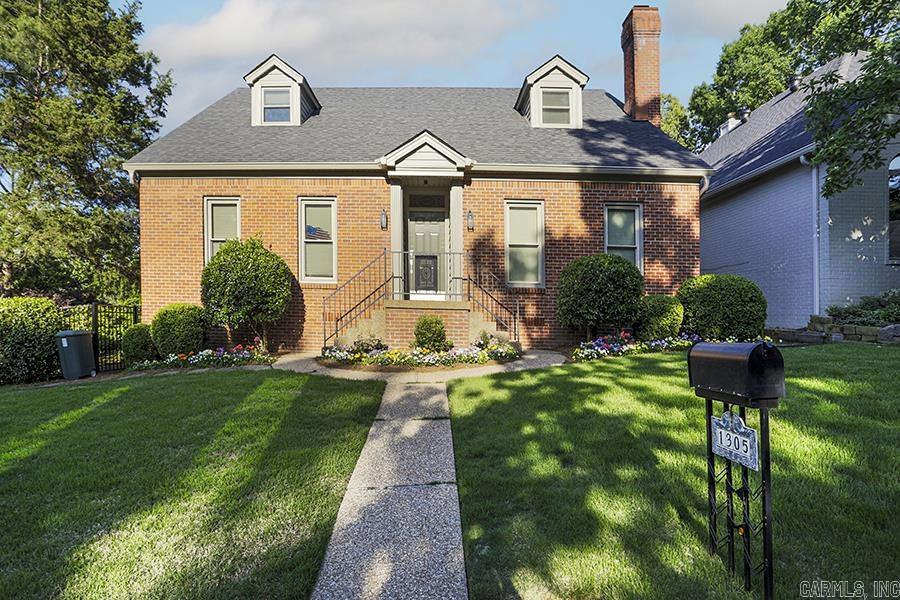 This beautiful custom home sits in the very desirable Hunters Cove neighborhood close to shopping and restaurants The property is being conveyed with an additional lot, which has been professionally landscaped as a stunning garden paradise including decorative pond. The home features classic details including dentil moldings, wainscoting, high ceilings, a center hall, and formal living & dining rooms which make it a wonderful place to entertain. The primary suite is on the main level and features a stunning remodeled bath and double closets with dramatic accent lighting. And there are three additional bedrooms that are spacious and private. This is a unique and rare opportunity to own a masterpiece like this right in the middle of Little Rock!