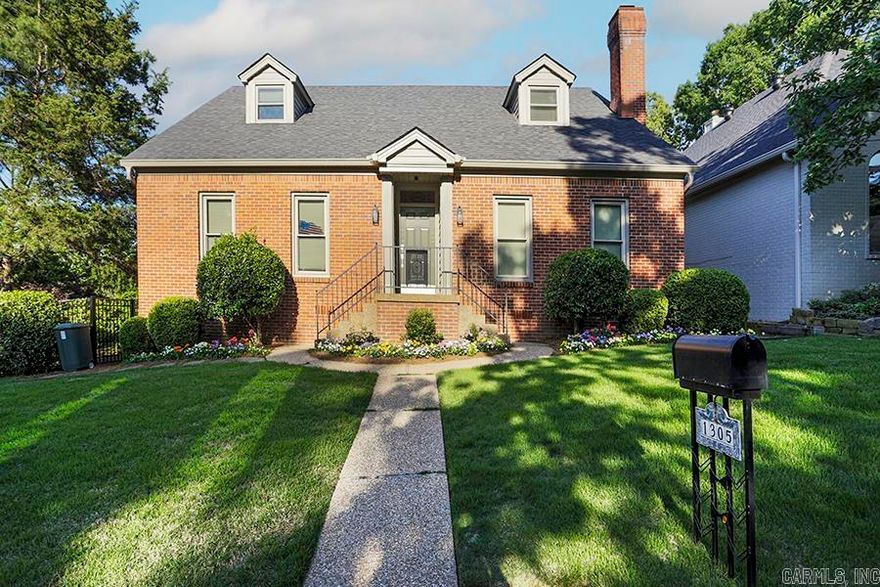 This beautiful custom home sits in the very desirable Hunters Cove neighborhood close to shopping and restaurants The property is being conveyed with an additional lot, which has been professionally landscaped as a stunning garden paradise including decorative pond. The home features classic details including dentil moldings, wainscoting, high ceilings, a center hall, and formal living & dining rooms which make it a wonderful place to entertain. The primary suite is on the main level and features a stunning remodeled bath and double closets with dramatic accent lighting. And there are three additional bedrooms that are spacious and private. This is a unique and rare opportunity to own a masterpiece like this right in the middle of Little Rock!