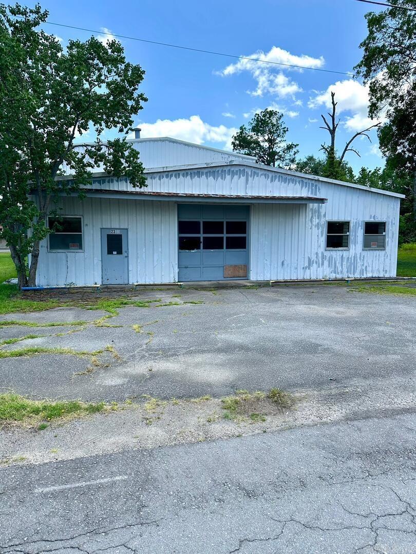The Perfect Business Space - Priced to Sell! This large 6000sf warehouse has great potential. Located in the heart of Pine Bluff's business district, this facility sits only 2 blocks off 28th Street and South Hazel. Whether you want to open a body shop, distribution center, janitorial or service business, or in need of a great warehouse, the possibilities are numerous. Several large overhead doors, 2 office spaces, restroom facility and plenty of parking available. Property is being sold AS-IS. **See Agent Remarks.