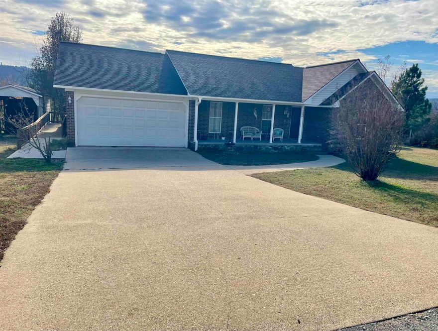 Located within city limits, this delightful brick home offers three bedrooms and two bathrooms. Inside, you'll find elegant hardwood and tile flooring, a convenient walk-in shower, and a spacious master closet with built-in shelving. The kitchen features a wall oven, while the exterior boasts a charming covered front porch and a back deck. Additional highlights include a garage and a storage building for all your organizational needs.