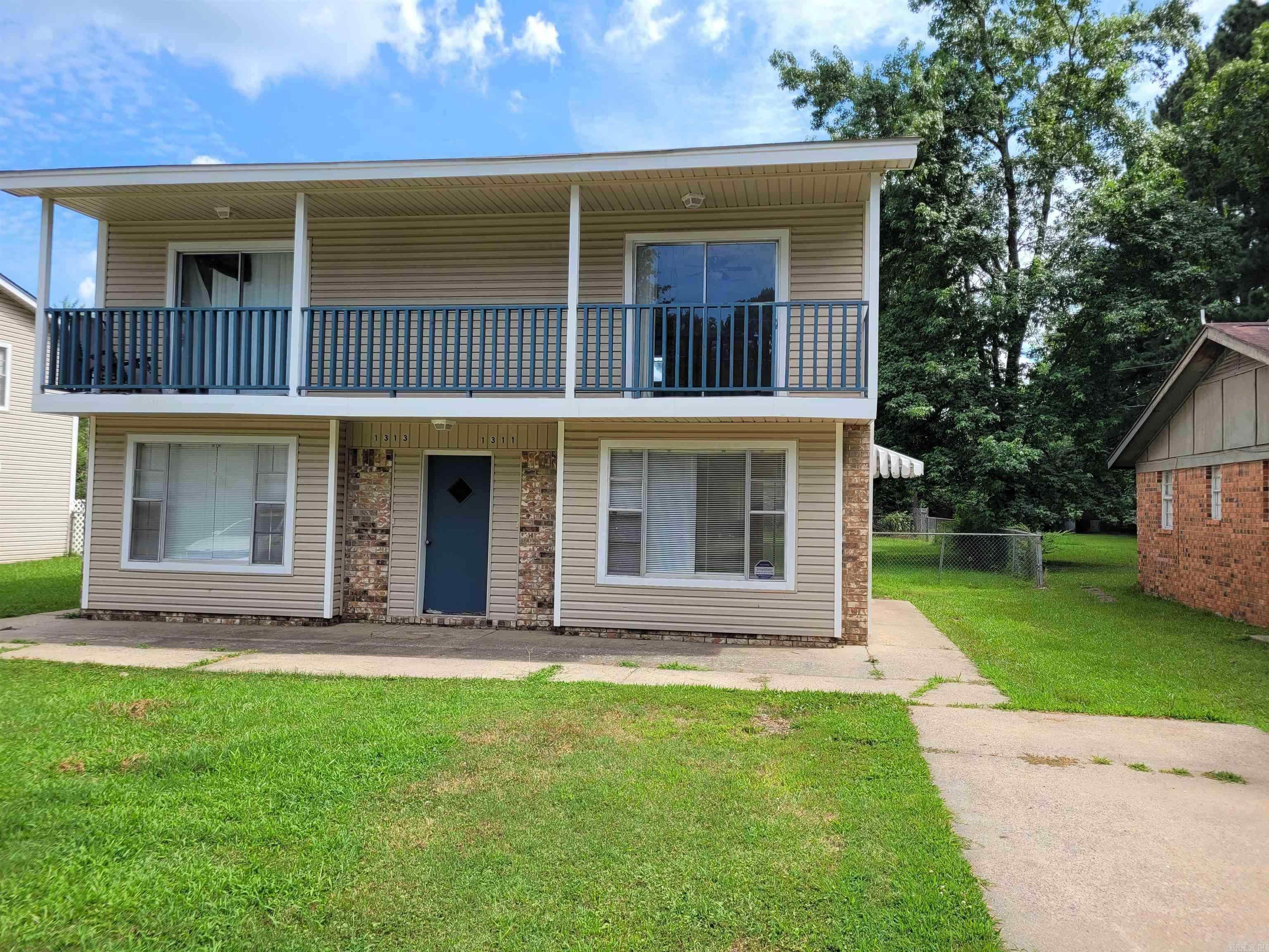 Fully Leased 4-Unit Investment Opportunity Near LRAFB! This property includes TWO separate duplex buildings (1311 & 1313, and 1317 & 1319) totaling four townhome-style units. Each unit offers 2 bedrooms and a full bath upstairs, with a half bath on the main level. All units are currently leased at $850/month, with potential for rent increases making this a solid option for investors looking to add value over time. Located in a visible, high-demand rental area near Little Rock Air Force Base, these units are easy to re-lease. Tenants cover electric and gas while the landlord covers water (each building has separate water meters) and lawn maintenance. Each unit has a laundry area on the back patio and access to a large, shared fenced yard—a rare find for townhomes. Units feature front-facing balconies, off-street parking, and a strong rental history. Showings available with accepted offer. See agent remarks for details and income/expenses. PLEASE NOTE: ALL UNITS ARE CURRENTLY LEASED; PHOTOS ARE FROM PREVIOUS LEASE LISTINGS.