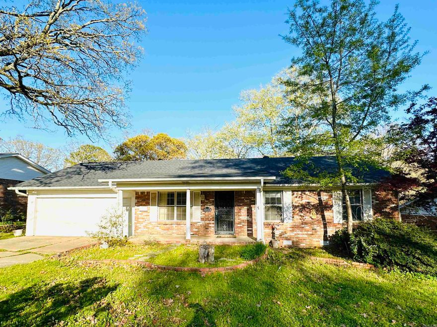 Charming all-brick, one-level home with three living areas, & an updated kitchen. Hardwood Floors and Tile throughout home.  The kitchen has quartz tile countertops, pendant lights over the island, a gas range, marble subway tile backsplash, roll-outs, under counter lighting, and a built-in desk. There are vaulted ceilings with exposed beams and a rock wall with a wood burning fireplace in the great room off the kitchen.  New roof installed April 2024 with a five year warranty.  New Vapor Barrier installed in April 2024.   Large Laundry Room with extra storage space.   Enjoy a partially covered deck which opens to a larger uncovered deck, and spacious backyard. Gutters.  Two-car garage and close proximity to shopping and dining. Great Space Buy!  Trane XR AC unit replaced in 2019.  Needs some TLC.  Great Potential.   AGENTS - SEE PRIVATE REMARKS!