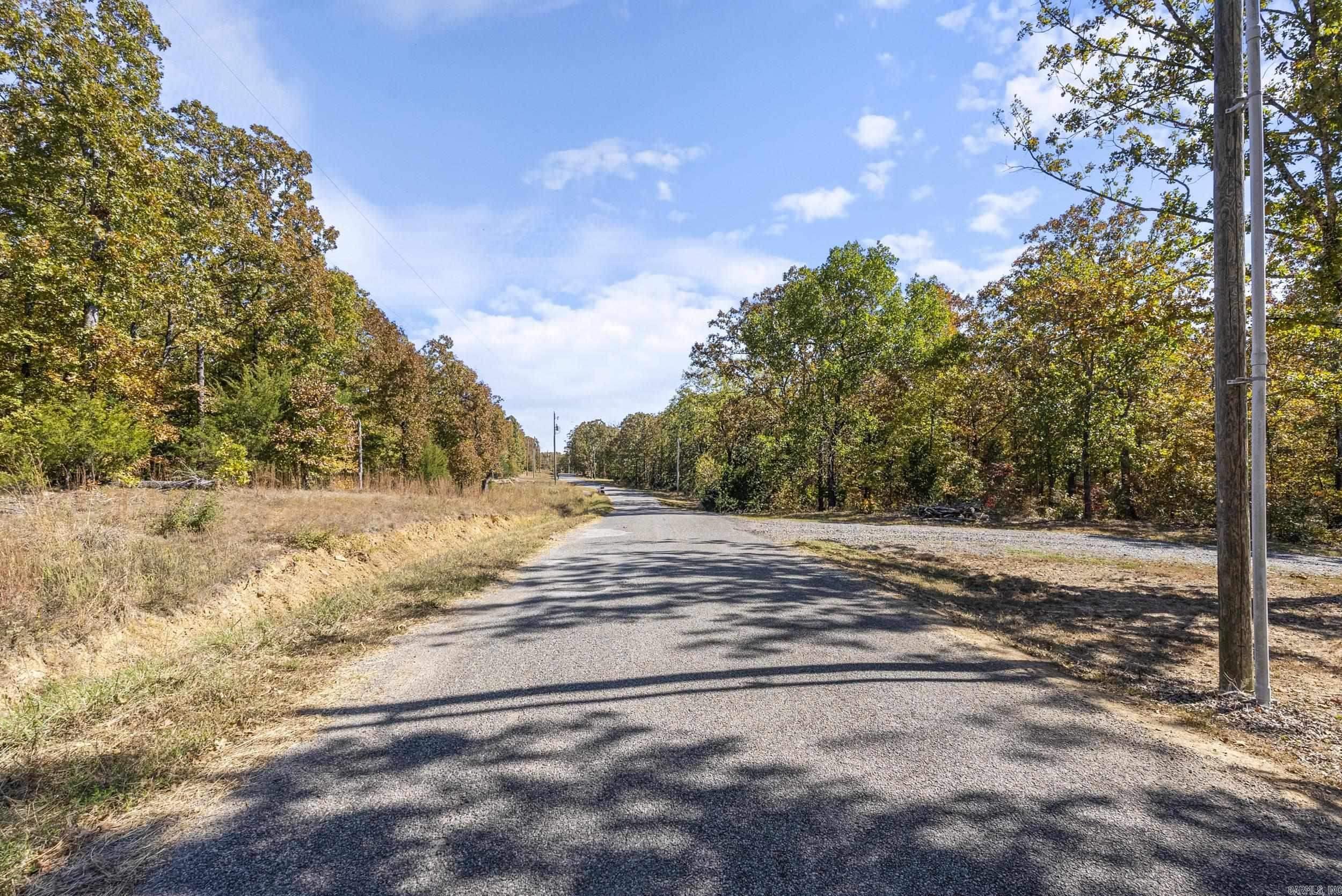 Embrace the charm of country living with the convenience of city amenities in the scenic Majestic Valley Subdivision. This 3 acre lot, covered with beautiful hardwood trees, offers the perfect setting for your dream home. City water is available and it is located in the Conway school district. This lot provides the best of both worlds - Peaceful, private living with quick access to all the conveniences of town. Come explore this prime piece of land and start building your future today!