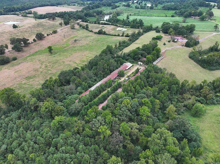 Acreage in Howard County! This mostly wooded property spans approximately 5.85 acres and includes two old chicken houses, perfect for conversion into barns. The parcel is well-equipped with electricity, a septic system, two wells, and access to rural water. A 12x20 block shed on the property offers the potential to be transformed into a tiny home for simple living or used as additional storage. Whether you're looking to establish your ideal homestead, start a small farm, or use the land for recreational purposes, this property offers endless possibilities.