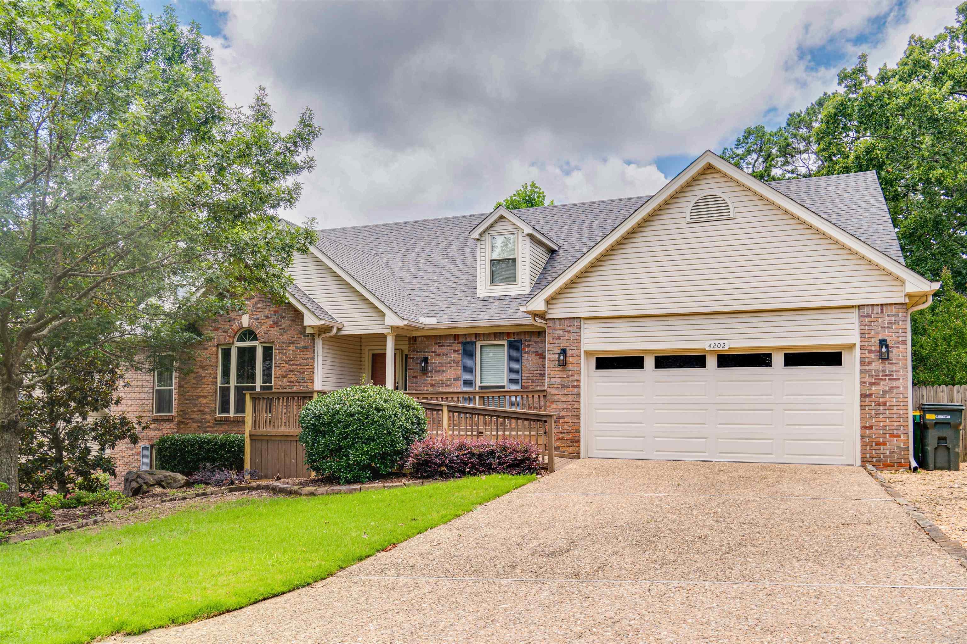 Beautiful 5-bedroom, 3.5-bathroom home in desirable West Little Rock neighborhood with no HOA & located near top-rated schools. You'll find a mix of hardwood, tile, carpet, & LVP, 16’ ceilings in the main living area, & a wood burning fireplace with gas insert. The primary bedroom features an impressive 13.5’ ceiling, creating a spacious, serene retreat. Three bedrooms upstairs & two downstairs, ideal for guests, home office or rental. Upstairs includes a handicap accessible bedroom & bathroom with roll-in shower. The finished walk-out basement with separate entry & zoned HVAC is perfect for added privacy. New roof ('24), water heater ('24), updated HVAC (main level '16; basement '21), energy efficient windows, French door & front storm door, whole-house fan, & garage & basement are upgraded with electrical for workshop use. The kitchen has quartz counter tops, pull-outs, pantry cabinet, & recently installed fridge & stove. Natural gas grill on covered deck & new front deck ramp. The 2-car garage features a belt-drive door opener for quieter operation. Gas connections for stove & dryer. Extra insulation & comprehensive house sealing! Move-in ready with lots of fresh paint!