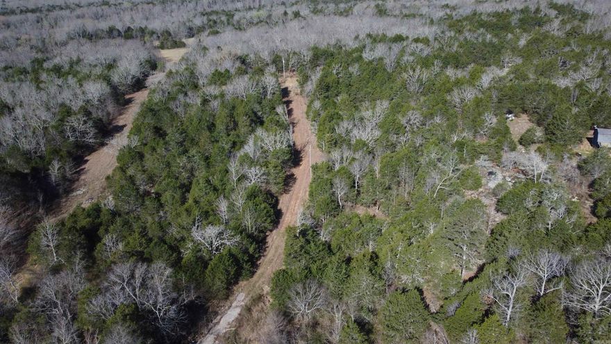 Hidden Creek Homestead Tract offers a quiet foothills retreat just northwest of Bradford in Jackson County. This unrestricted wooded property appears to have once served as a rural homesite, with an existing clearing and established roadway already in place. Power is located approximately 700 feet from Jackson County Road 5, making future improvements practical.  A creek crossing leads deeper into the timber where a private, secluded clearing creates the perfect setting for a cabin, new home, RV site, garden, or food plot. The tract is heavily wooded yet easy to traverse, providing excellent cover and habitat for deer, turkey, and other native wildlife.  With some timber stand improvement, trail development, and strategic game openings, this property could become an outstanding hunting getaway, weekend retreat, or private homestead location. If you’ve been searching for unrestricted acreage with nearby rural water access and strong recreational potential, this foothills tract deserves a closer look.