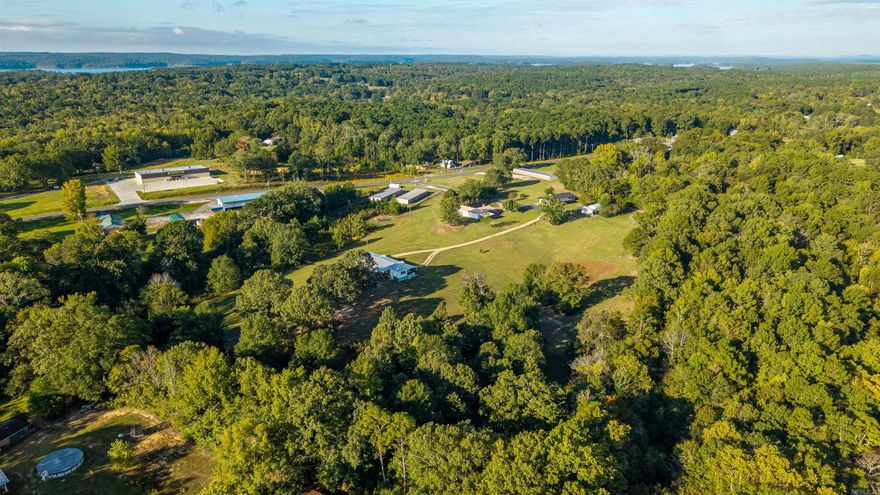 THIS GEM IS A RARE FIND! INCOME PRODUCING INVESTMENT OPPORTUNITY MINUTES FROM LAKE DEGRAY;  Currently has 50 storage units at 95% occupency with plenty of room to add much needed and high demand boat storage.    2 LARGE Homes, massive shop ,2 wells on   Hwy 7 frontage, on 17.94 +\- acres, in addition there's a concrete pad with a seperate address to accommodate a large RV or small mobile home. will cash flow from day one.