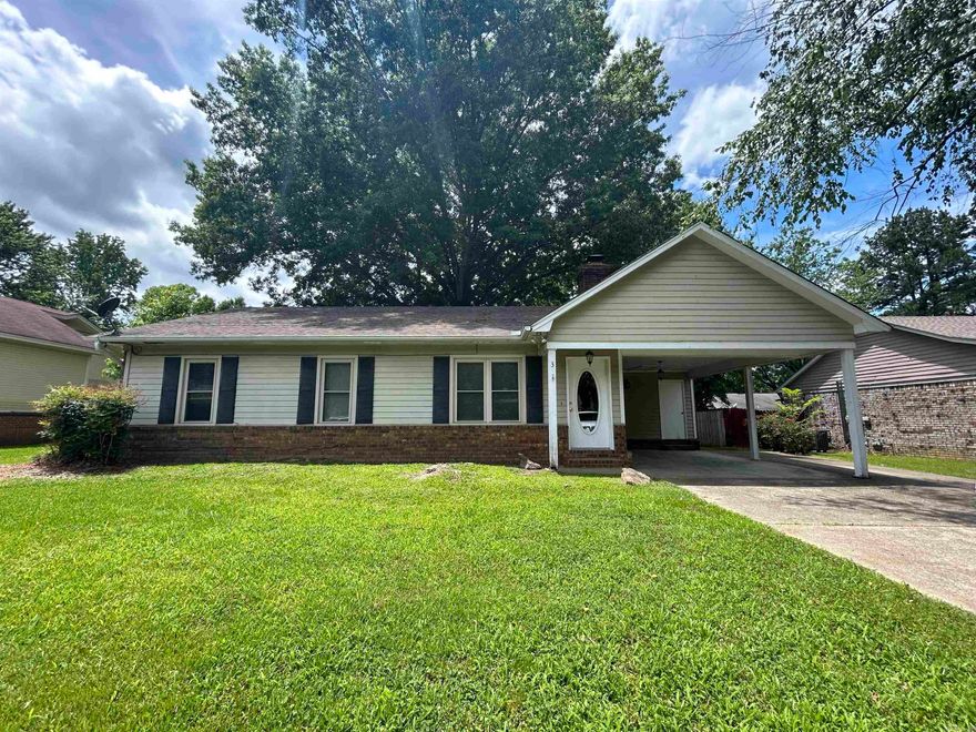 Welcome to this charming 3-bedroom, 2-bath home perfect for comfortable living and entertaining. The living room features a cozy wood-burning fireplace, creating a warm and inviting atmosphere. The kitchen boasts granite countertops, smooth top stove, a breakfast bar, informal dining area, and a convenient pantry. A large laundry room with cabinets offers ample storage and functionality.  The master bedroom includes a nice walk-in closet, providing plenty of room for your wardrobe. Enjoy outdoor living on the large screened-in porch, ideal for relaxing and enjoying the nice backyard. Additional storage is available with a storage building in the backyard and a storage room under the carport. For your peace of mind, the home is equipped with a security system. This is an established neighborhood with a low traffic street front. Don't miss the opportunity to make this wonderful property your new home! See floor plan for approximate dimensions.