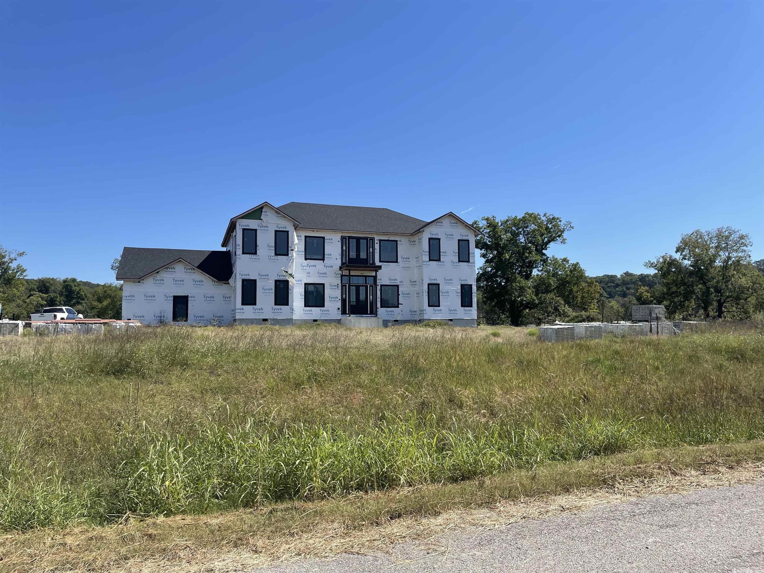 Beautiful location on the White River near Flippin. 4 bedrooms, 3.5 baths and ready for finishing touches on two lots (1.8 acres m/l). This 5000 square foot home offers direct access to the White River. Located near Bull Shoals lake, recreational opportunities abound nearby. Home is unfinished. Materials on-site convey, inventory available on request.