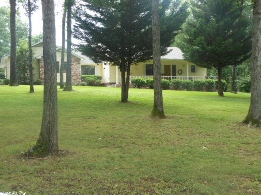 Neat & squeaky clean on 5 acres mol, extra septic & water meter as well as electrical hookup with paved driveway & parking area, porches on front & rear, nice open kit ,dining & living area, large family room as well, lots of patio areas, storm cellar less than 10 minutes to town.