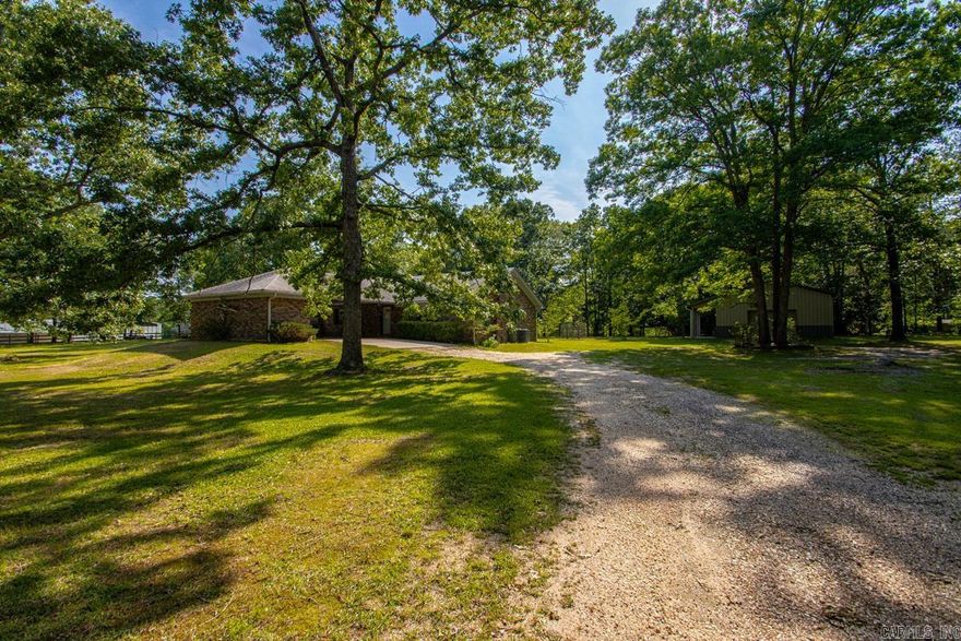 2145 sqft traditional home on 2.25 level acres featuring 3 bedrooms on the same level, spacious living room with wood-burning stove, kitchen/dining combo, and large laundry room. Primary bedroom includes dual ensuites. 24x30 shop with electricity offers great workspace potential. 2-car carport. Water heater replaced in 2025 and HVAC updated in 2017.