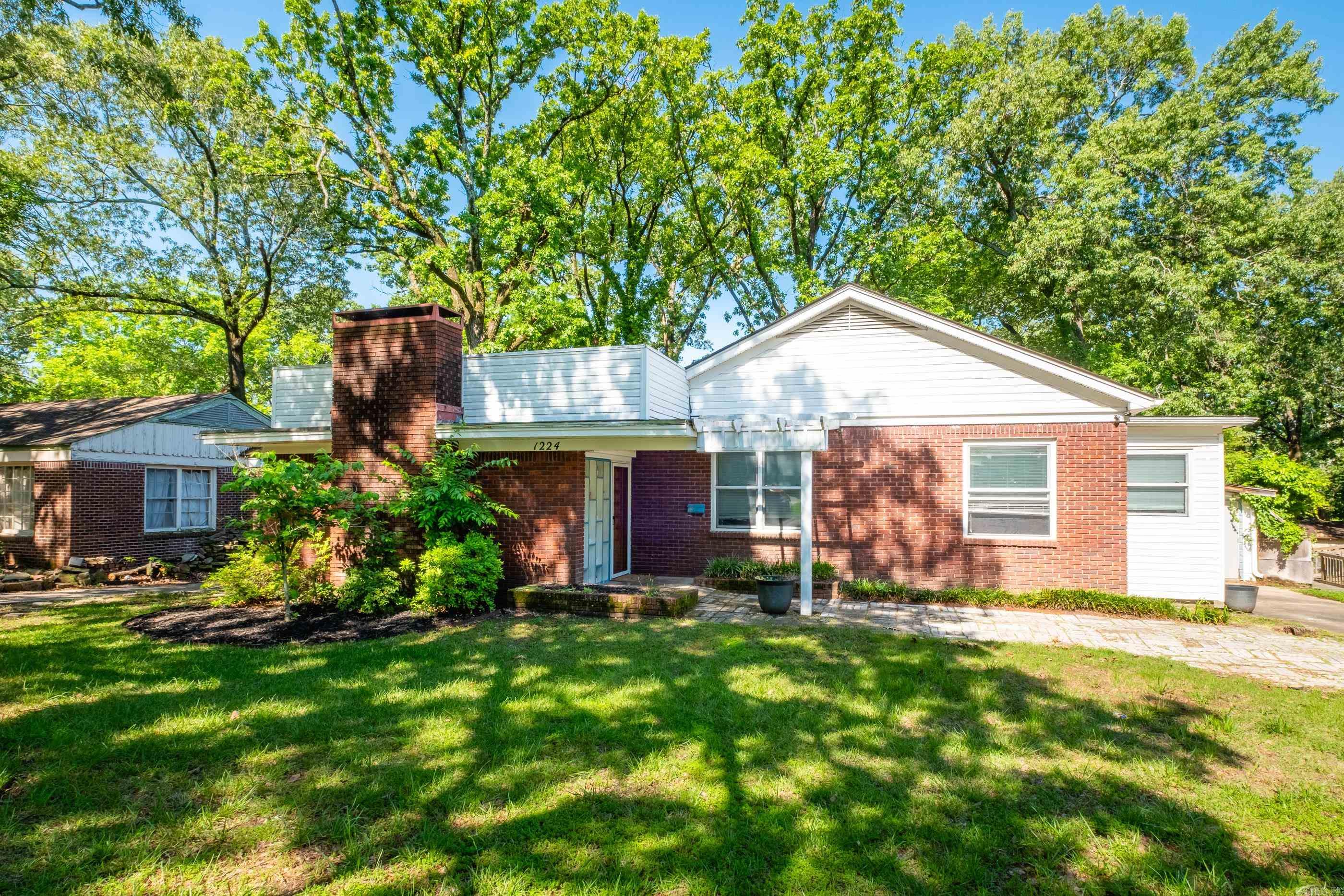 Charming 1950s home in the heart of Little Rock! This well-maintained property features a spacious living room, formal dining room, and a generously sized kitchen—perfect for entertaining or family gatherings. Enjoy peace of mind with upgraded wiring, electrical, plumbing, lots of fresh paint, newly painted cabinets in kitchen and beautifully updated bathrooms. You’ll find ample storage throughout the home, along with a prime location just minutes from UALR, UAMS, St. Vincent’s, and shopping. The backyard is a true retreat with a pergola-covered patio, hot tub, and a fully fenced, flat yard—ideal for kids or pets. Don’t miss this move-in-ready gem!