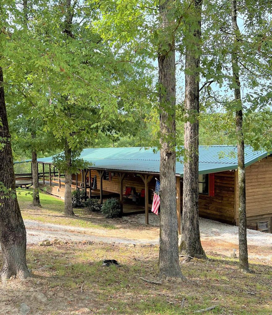 Natural paradise!  2 Bed 2.5 bath. 1024 sq ft. log home. Built in 2013. Will you sit on this beautiful wrap around porch and enjoy the serenity of  bird songs and the gorgeous mountain views or relax in the covered entertainment area with friends and family as you cook a delicious meal? A sparkling year around creek flows creating the northern boundary of the rolling hill property. This home is a about a mile from The Caddo River and all of the river fun. Despite the serene location, you are a short drive to Hot Springs restaurants, hiking, hunting, crystal digging, lake sports, or dig a diamond at Crater of Diamonds State Park. A covered walkway brings you to a 40x20 heated and cooled bonus room/ shop area with a half bath for all of your entertaining needs. Will this be your forever home or a vacation retreat?? Schedule your showing today! See agent remarks.