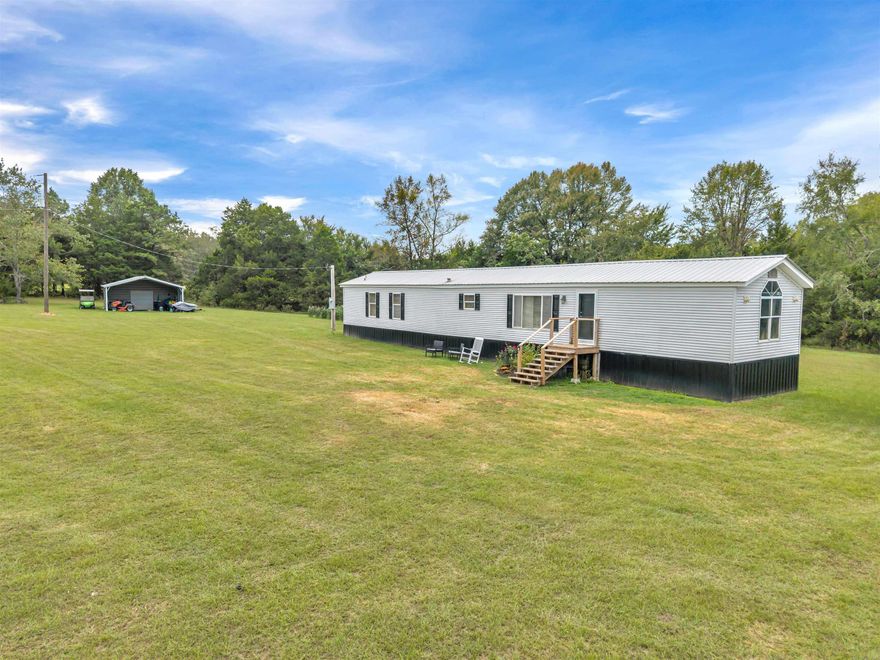 2/2 single wide mobile home sits on 16.88+/- acres on Tucker Mtn. Road! Very secluded. Approx. 80% pasture and 20% wooded. Mostly fenced. The 1998 mobile home is in great condition!  New LVP flooring and the central heat/air is only 2 years old. Fresh interior paint 2 years ago and the septic is also 2 years old. 2-car carport with storage area will convey.