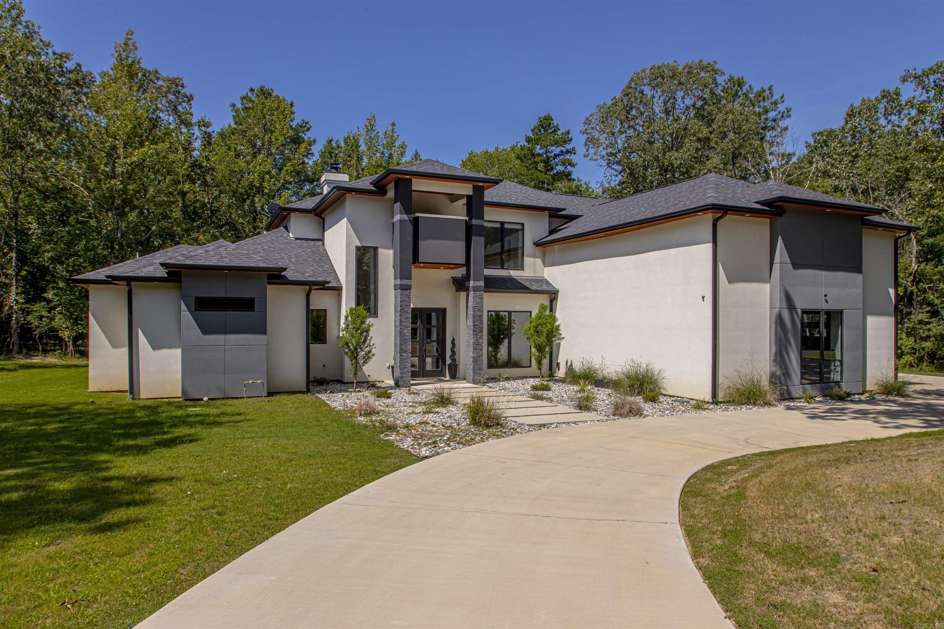 Introducing the epitome of modern luxury living on over three sprawling acres while still only miles from town! 3 BR 3.5 BA. You will be immediately captured as you walk into this immaculate home. Featuring custom finishes w/ an inviting open living area surrounded by windows~spilling natural light and allows you to watch deer in your yard from anywhere in the house! A chefs dream in the expansive kitchen featuring a massive granite topped island, six-burner gas range, separate built in ice maker & double oven! Downstairs you will also find a dedicated office w/ stunning views, formal dining & a beautiful kitchen nook w/ built in, a versatile small room tailored for any need and a GRAND master suite Unwind in the master bath which showcases his/her sinks and oversized his/her walk in closets with an xtra washer/dryer connection for ultimate convenience. Upstairs you'll find an oversized bonus/media room surrounded with glass accents. 2 additional bedrooms and 2 full baths situated perfectly. All LED inter/ext lights WiFi comp. Camera system & sprinkler. Outdoor fireplace that steps down to a fire pit area for smores night! Where exquisite design meets tranquiity! Agents see remarks