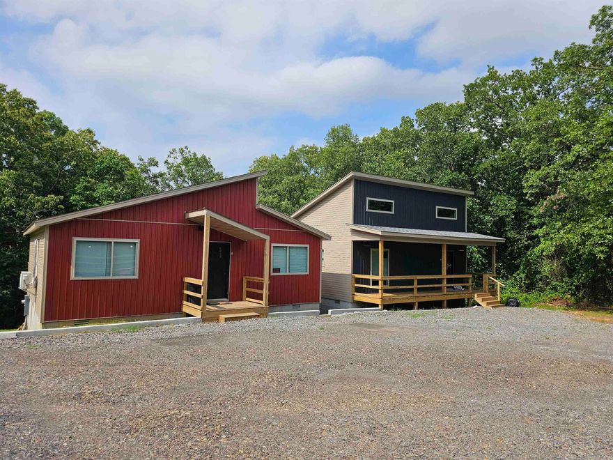 4 new single family homes and 1 Triplex.  The 4 homes were built 2023 and triplex was built in 1970 and remodeled to be a triplex (2023).  The single family homes are 2 bedrooms with 1 bathroom. The triplex has two 1 bedroom/1 bath units and one 2 bedroom/1 bath unit.  The property consists of a total of 7.42 acres and there is plenty of room to expand and build more.