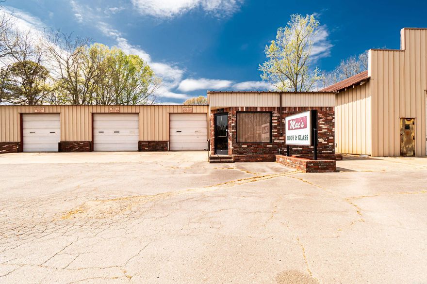 Commercial property with 7,896 sqft of space, previously used as a glass and body shop and now vacant. Equipped with an air compressor, car lift, and a dedicated paint area, making it ready for a variety of business uses.  Features include multiple large shop areas, an additional shop in the back, office space, and a remodeled bathroom. Property also has gas and electric heat and air.  Plenty of space and flexibility for your next business or investment opportunity.