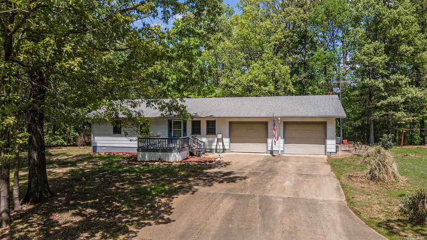 Well-maintained and full of charm, this 3-bedroom, 2.5-bath home on 17.4± acres in Story, AR is now available. Located at 44 Stearman Drive, just 4 miles from Lake Ouachita’s Highway 27 Fishing Village, the property offers a scenic country setting with convenient access to public boat launches, swimming areas, and campgrounds. Built in 1998 and fully furnished, the home features 1,448± square feet of comfortable living space, an all-electric setup, and a 2-car garage. The outdoor space includes a durable composite deck and a 75x40 shop (with 40x40 enclosed) equipped with electric, water, a full bathroom, and a utility sink—ideal for projects, storage, or a workspace. The land is cleared around the home and shop, with the remainder covered in mature hardwoods and featuring a wet-weather creek at the back. Additional features include a private well, city water available at the road, water spigots near the shop, two apple trees, one plum tree, and a garden spot. The property also offers concrete drives, and fencing—making it move-in ready or a strong candidate for rental use.