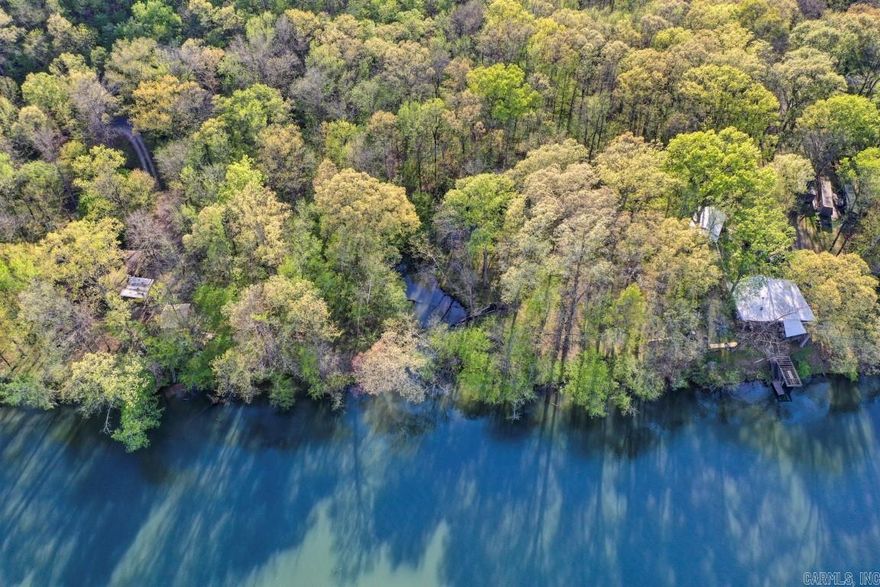 Welcome to your own private paradise where the water meets the woods. This stunning 4.10-acre property offers an extraordinary 1,054 feet of shoreline along beautiful Lake Catherine, creating the perfect canvas for your dream home. Imagine waking each morning to breathtaking lake views, sipping coffee as the sunrise dances across the water, and breathing in nothing but fresh mountain air. Peace and quiet are not just promises here they are a way of life. Nestled among tall hardwoods and gentle terrain, these two adjoining lots provide ample space for a custom estate, guest house, private dock, or whatever your imagination desires. Waterfront properties of this size and caliber rarely come available in the Hot Springs area, making this a truly exceptional opportunity. Whether you are seeking a permanent residence or a tranquil retreat, this land is calling your name. Schedule your private showing today and start dreaming out loud.