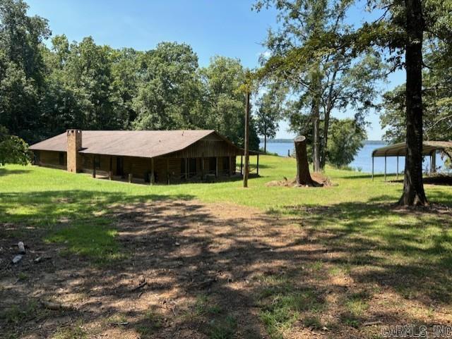 Beautiful and spacious log home on Lake Erling in Taylor, AR. 4 bed/2 bath and completely furnished. Sits on 3.7 Acres and has a covered 1100 sq ft porch. 2010 - retainer wall was replaced and added area to launch a boat.